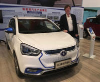 John Kirton with an electric car made by JAC